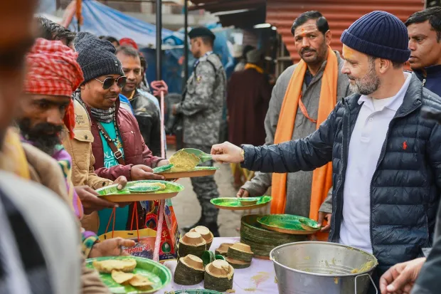 Gandhi organised a 'bhandara' near the temple premises and served food to the devotees and sadhus. He inquired about the wellbeing of the devotees during the distribution of food. 'Chole-puri', halwa, papad, and pickles were distributed at the 'bhandara'. Food was distributed to around 500 people.(PTI Photo)