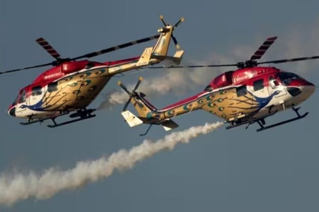 Sarang helicopter display team from India, perform during second day of the Dubai Air Show, United Arab Emirates.(AP)
