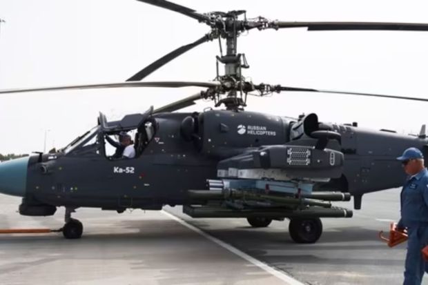 A Russian KA-52 helicopter is pulled into position at the Dubai Air Show in Dubai, United Arab Emirates, Wednesday.(AP)