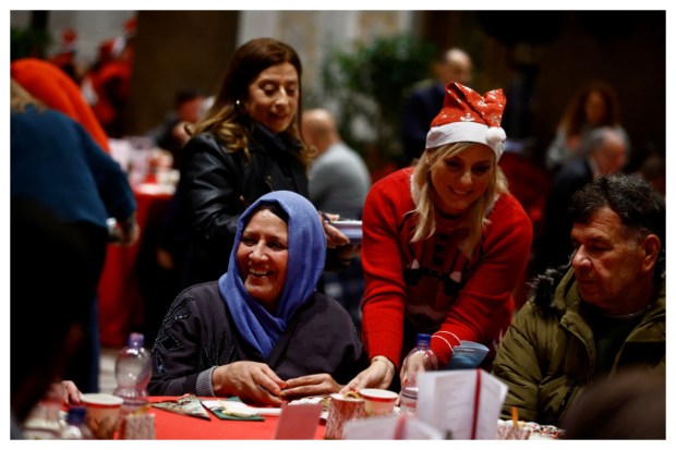 Emotional reactions unfold during the traditional Christmas lunch for the needy and poor organized by Christian charity Community of Sant'Egidio in the Basilica of Santa Maria in Trastevere, Rome, Italy, on December 25, 2023. (Image: Reuters)