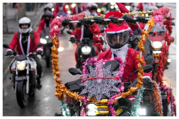 Festive joy takes to the streets as bikers don Santa Claus costumes and ride their bikes during a heartwarming Santa Claus parade in Belgrade, Serbia, delivering toys to patients at a children's hospital on Saturday, December 23, 2023. (Image: AP Photo)