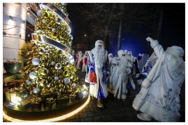 Revelers adorned as Ayaz Ata (Father Frost) - the Kazakh counterpart of Santa Claus - joyfully participate in a city procession, heralding the arrival of the New Year and Christmas season in Almaty, Kazakhstan. (Image: Reuters)