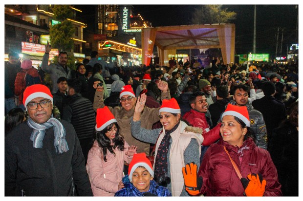 Festive cheer fills the air as tourists arrive at Mall Road in Manali for Christmas and New Year celebrations on December 25, 2023. (Image: PTI Photo)