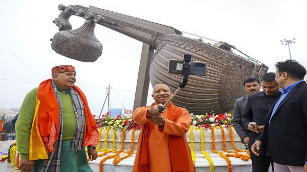 Uttar Pradesh Chief Minister Yogi Adityanath clicks a selfie at Lata Mangeshkar Chowk, in Ayodhya. (Image: PTI)