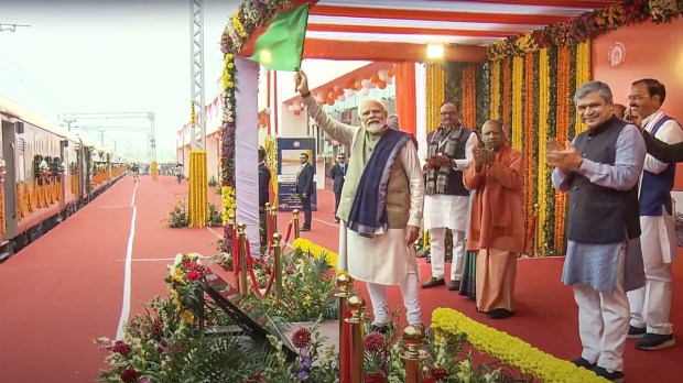 Prime Minister Narendra Modi flags off a train as he inaugurates the redeveloped Ayodhya Dham Station in Ayodhya on Saturday, December 30, 2023. Also present are Uttar Pradesh Chief Minister Yogi Adityanath, Deputy Chief Minister Keshav Prasad Maurya, and Union Railways Minister Ashwini Vaishnaw. (Image: PTI)
