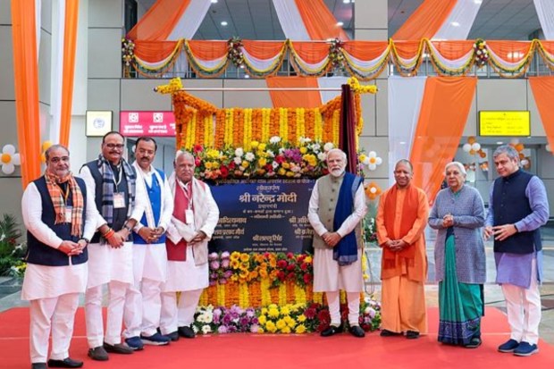 PM Modi with UP CM Yogi Adityanath, Deputy CM Keshav Prasad Maurya, Union Railways Minister Ashwini Vaishnaw and others during the inauguration of the redeveloped Ayodhya Dham Station. (Image: PTI)