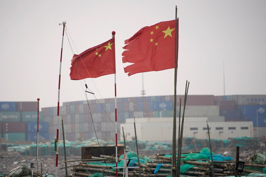 Chinese flags flutter at the Yangshan Deep Water Port in Shanghai, China (Image/Reuters)