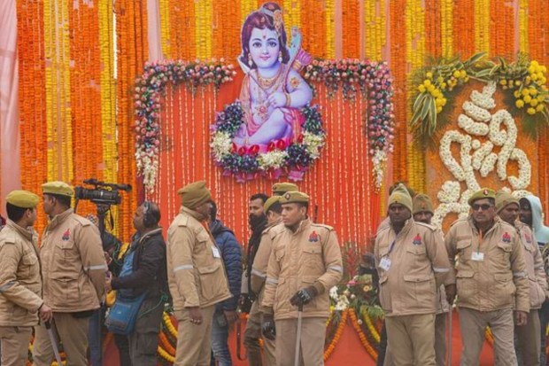Police personnel stand guard near the entrance to the Ram temple, ahead of the consecration ceremony, on January 21. (Image: PTI)