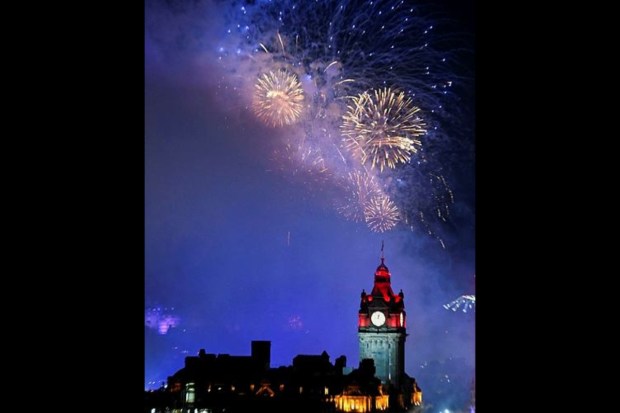 Fireworks light up the sky over Edinburgh Castle and the Balmoral Clock to mark the New Year in Edinburgh. (Reuters)