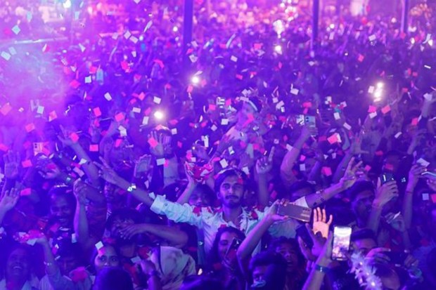 People dance during a party on New Year's day in Mumbai on January 1. (Reuters)
