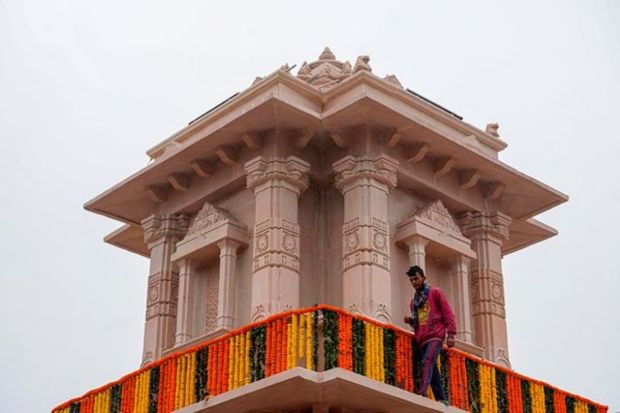 A labourer at work on a cold winiter morning, ahead of the consecration ceremony of Ram Mandir, in Ayodhya, Saturday, Jan. 20, 2024. (PTI Photo/Kamal Kishore) 