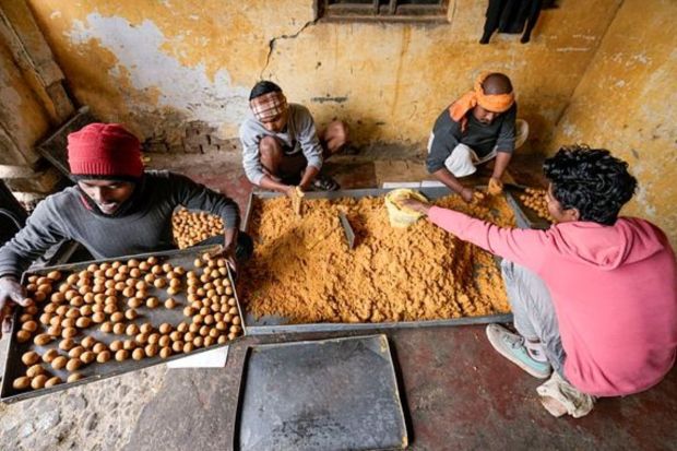 Workers prepare 'laddoos', ahead of the consecration ceremony of Ram Mandir, in Ayodhya, Saturday, Jan. 20, 2024. (PTI Photo/Kamal Kishore)