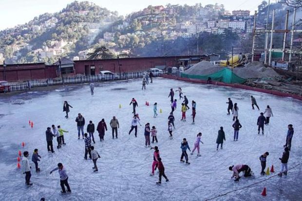 Tourists at an ice-skating rink at Lakkar Bazar, in Shimla. (PTI Photo)