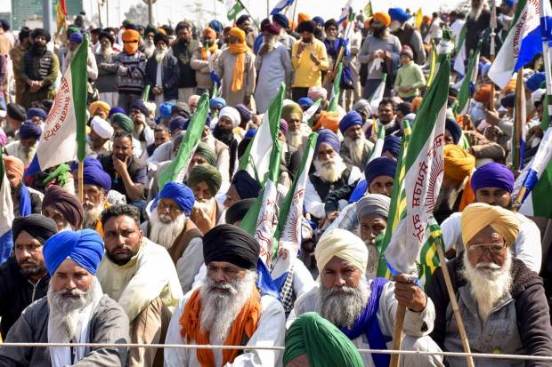 Protesting farmers listen to a speaker at the Shambhu Border during the Samyukta Kisan Morcha's (SKM) Bharat Bandh, in Patiala district. (PTI Photo)