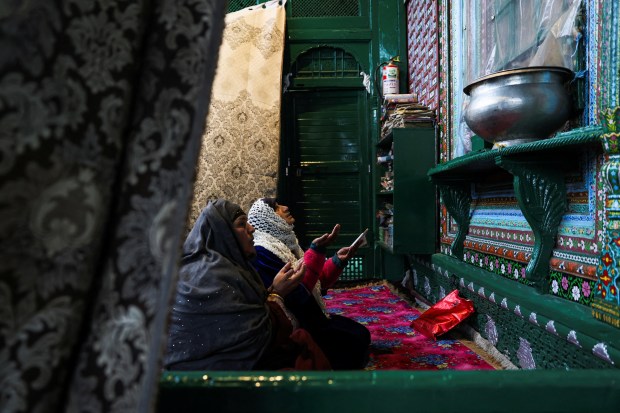 Kashmiri Muslim women pray inside the shrine of Sufi Saint Mir Syed Ali Hamadani on the second day of the Muslim holy fasting month of Ramadan in Srinagar. REUTERS