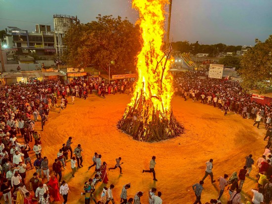 Devotees perfom 'Holika Dahan' as part of Holi festival celebrations, in Gandhinagar on Sunday (PTI)