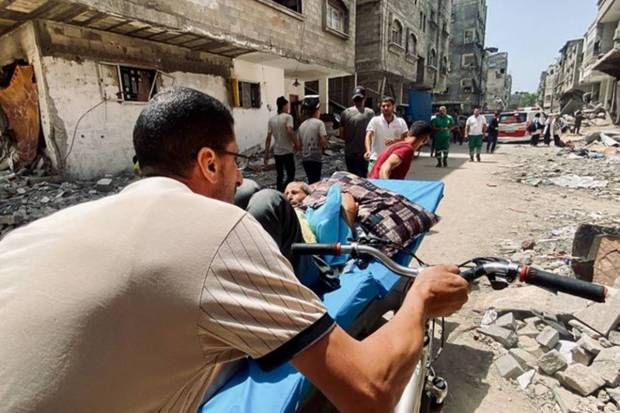 Palestinians evacuate Kamal Adwan hospital following an Israeli strike, amid the ongoing conflict between Israel and the Palestinian Islamist group Hamas, in Beit Lahia in the northern Gaza Strip. REUTERS