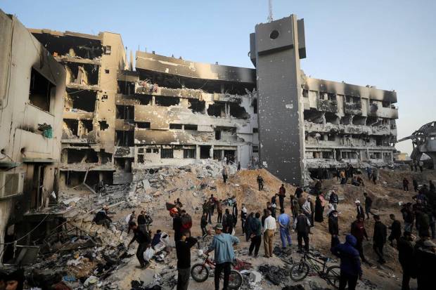 Palestinians inspect damages at Al Shifa Hospital after Israeli forces withdrew from the hospital and the area around it following a two-week operation, amid the ongoing conflict between Israel and Hamas, in Gaza City. REUTERS