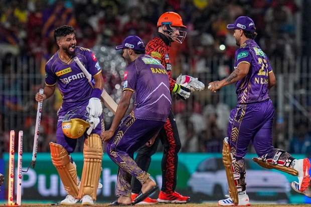 Kolkata Knight Riders players celebrate after winning the IPL 2024 final cricket match against Sunrisers Hyderabad at MA Chidambaram Stadium. KKR's bowlers Mitchell Starc and Vaibhav Arora provided crucial early breakthroughs, dismantling SRH's top order within the powerplay. (PTI Photo)