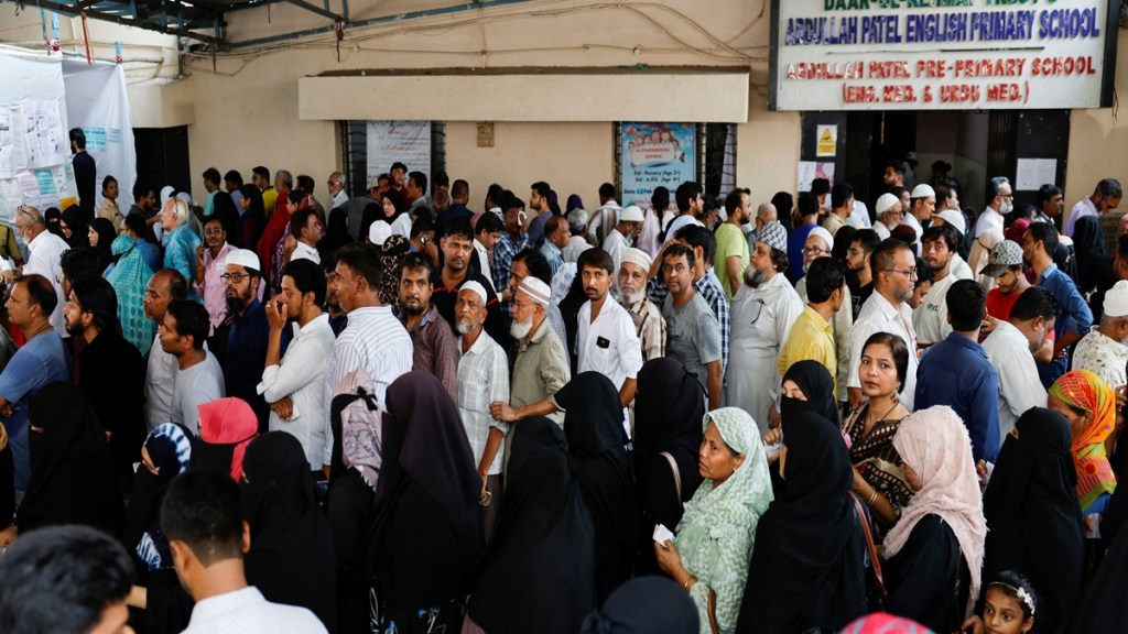 People wait to vote at a polling station during the fifth phase of India's general election, in Mumbra, on the outskirts of Mumbai, India, May 20, 2024. REUTERS/Francis Mascarenhas