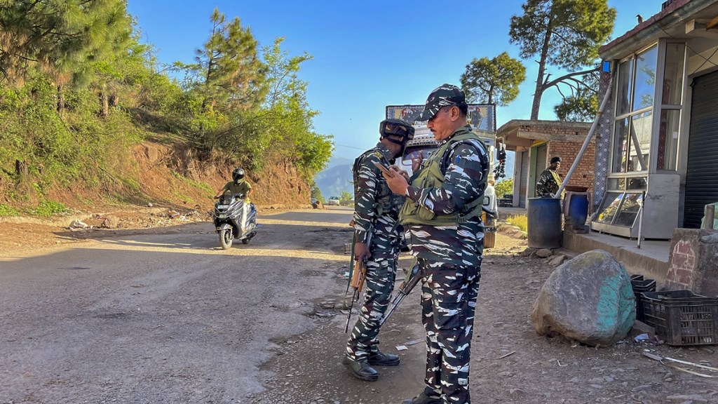 Security personnel stand guard during cordon-and-search-operation after at least one soldier was killed and four were injured as terrorists ambushed an Indian Air Force (IAF) convoy on Saturday, in Pooch district, Sunday, May 5, 2024.