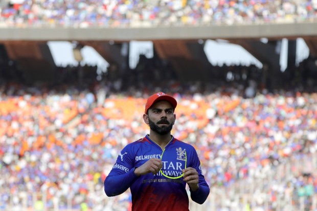 RCB's former captain Virat Kohli gave a witty response to Punjab Kings' Rilee Rossouw's dismissal during an IPL match on May 9. Mimicking Rossouw's gun-style celebration, Kohli added a humorous touch to the game. (Express photo by Nirmal Harindran)