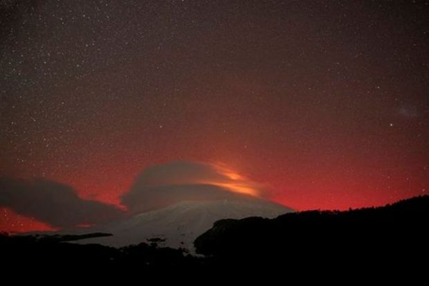 A view shows the lights of an Aurora Borealis caused by a geomagnetic storm near the border cities of Mexicali, Mexico and Calexico, U.S. as seen from Tecate, Mexico. 