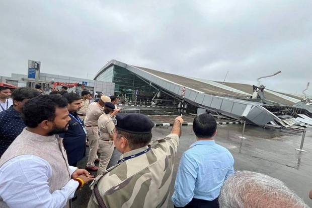 Civil Aviation Minister K Ram Mohan Naidu inspecting the damaged roof of the Delhi Airport's Terminal 1. (Photo source: PTI)