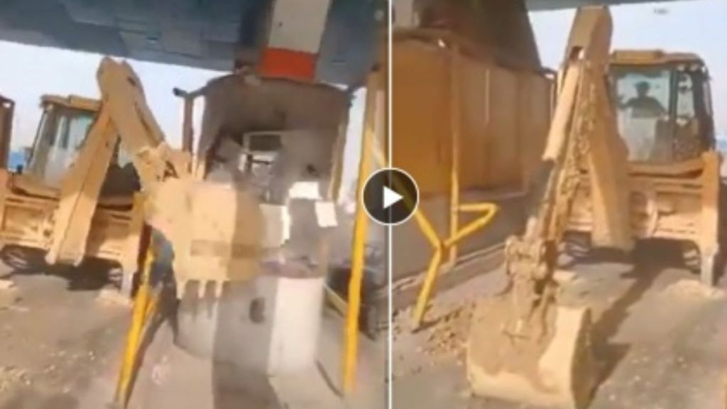 a bulldozer operator can be seen demolishing toll booths