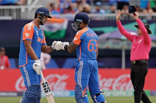 India's Suryakumar Yadav, center, celebrates with batting partner Shivam Dube after hitting a six. (AP/PTI)