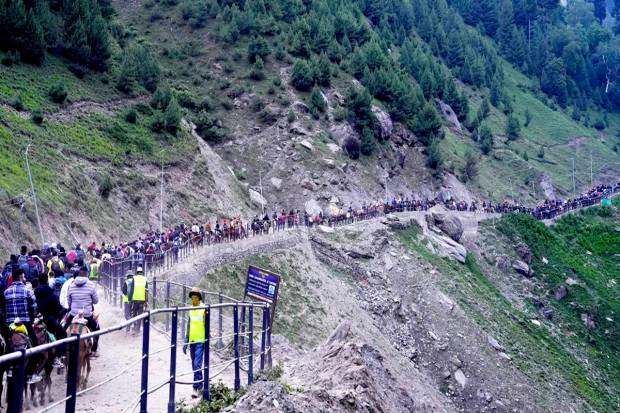 Pilgrims enroute to the holy cave shrine of Amarnath from the Baltal base camp during the annual Amarnath Yatra, in Ganderbal district. (PTI Photo)