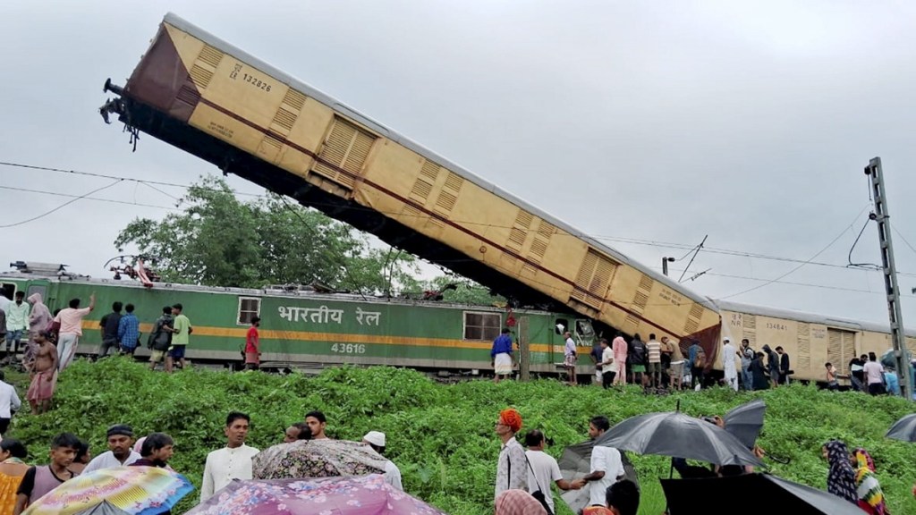 Locals gather after the Kanchanjungha Express collided with a goods train, near New Jalpaiguri railway station, on Monday, June 17, 2024. (PTI Photo)