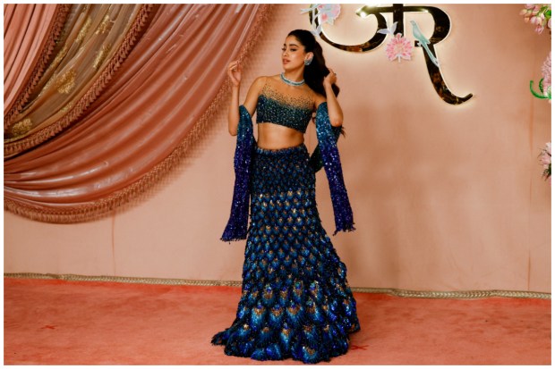 Bollywood actor Janhvi Kapoor spotted arranging herself just before getting papped at the sangeet ceremony of Anant Ambani and Radhika Merchant. (Image: Reuters/Francis Mascarenhas)