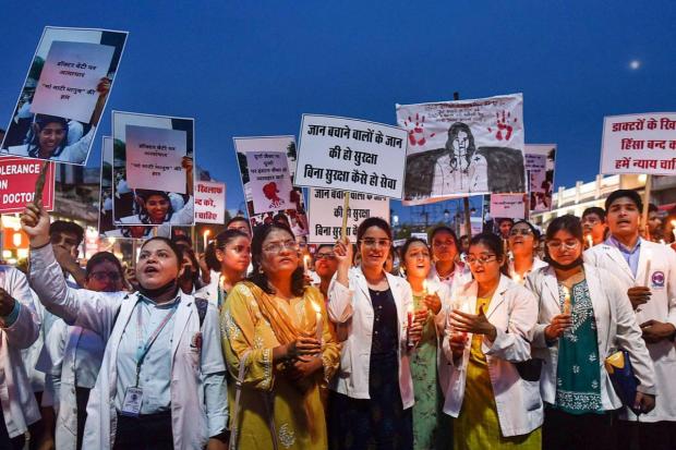 Prayagraj: Doctors stage a candlelight protest amid the 24-hour nationwide strike called by the Indian Medical Association (IMA) demanding justice for the woman doctor who was raped and murdered at Kolkata's RG Kar Medical College and Hospital. (PTI)