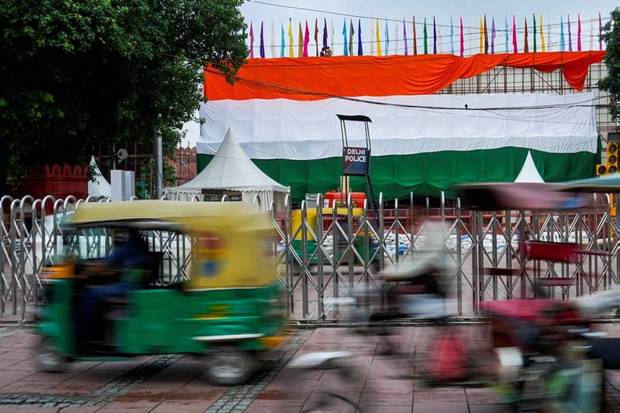 Red Fort covered with the tricolour ahead of the Independence Day celebrations, in New Delhi. (Photo source: PTI)