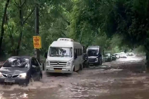 Several areas of Delhi witness waterlogging following overnight heavy rainfall. The image have been taken from Dhaula Kuan, near Sri Venkateswara College. (Photo source: ANI)