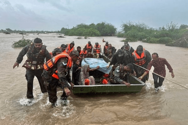 Army forces are engaged in a rescue mission of stranded individuals in flood-affected areas of Jamnagar, Rajkot and Dwarka, following heavy rainfall. (PTI Photo)