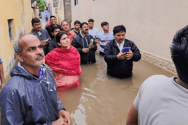 BJP leader Rivaba Jadeja surveys a region in Jamnagar that has been impacted by flooding due to heavy rains. (PTI Photo)