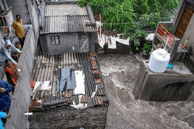 Waterlogging at an area after heavy rains in Rajkot on Tuesday. (PTI Photo)