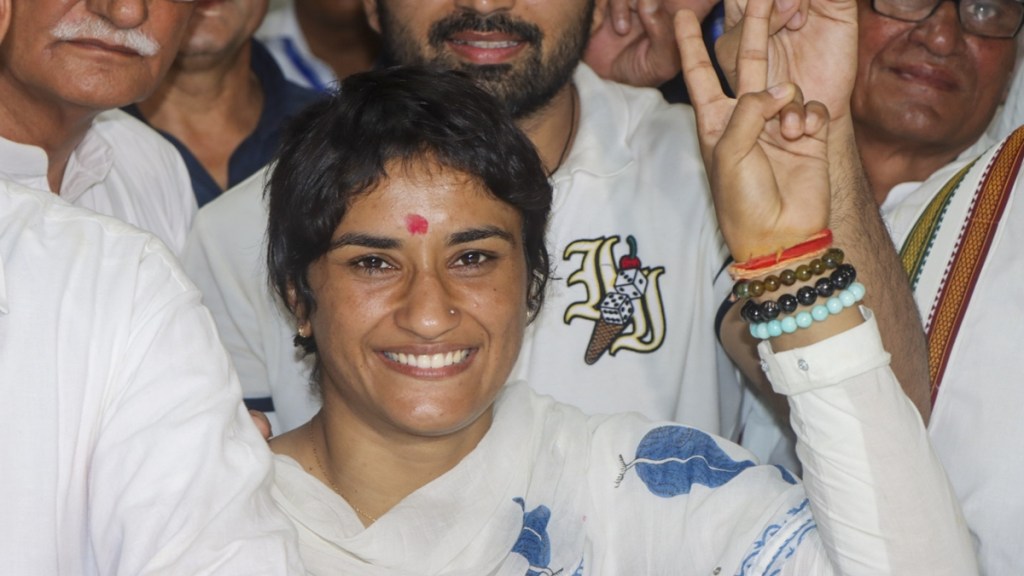 Former wrestler and Congress candidate from Julana constituency Vinesh Phogat with husband and wrestler Somvir Rathee and others during her nomination filing for the upcoming Haryana Assembly elections, in Jind district, Wednesday, Sept. 11, 2024. (PTI Photo)