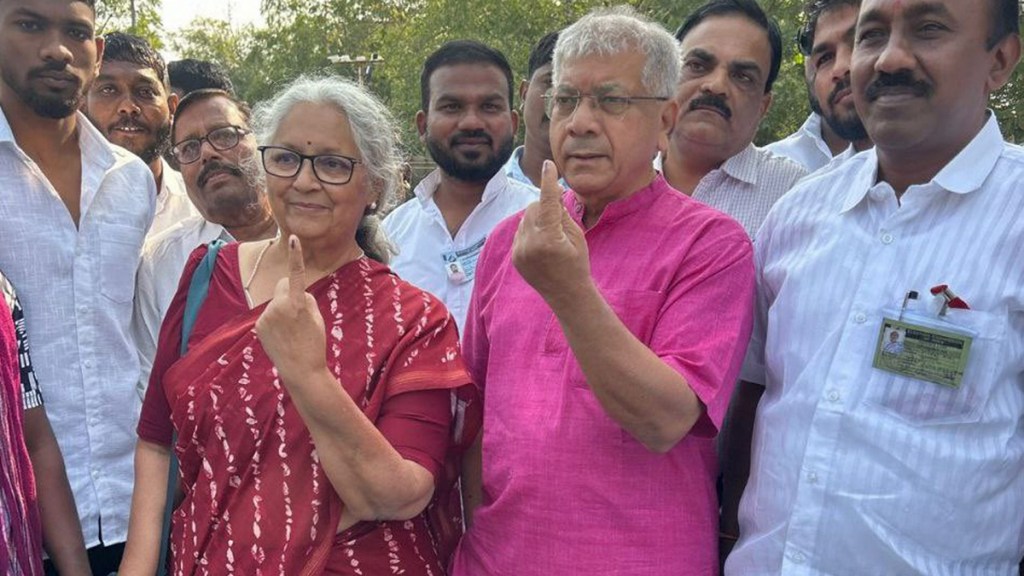 Vanchit Bahujan Aaghadi President Prakash Ambedkar and his wife show their fingers marked with indelible ink after casting votes during the Maharashtra Assembly elections, in Akola district, Wednesday, Nov. 20, 2024. (PTI Photo)