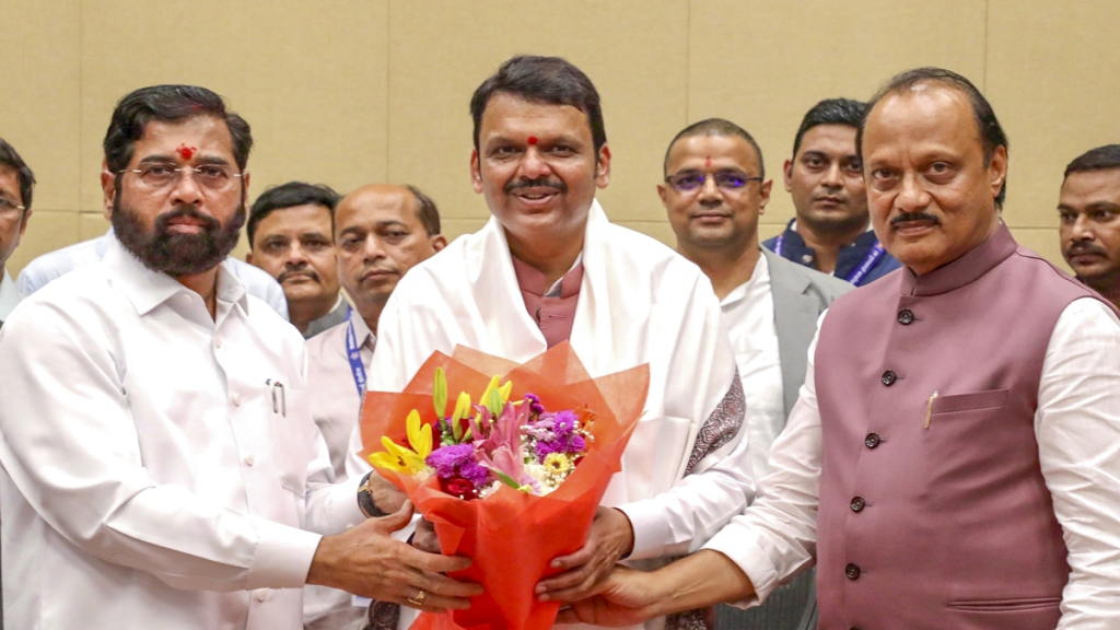 Maharashtra Chief Minister Devendra Fadnavis being felicitated by Deputy CMs Eknath Shinde and Ajit Pawar at the Cabinet meeting, in Mumbai. (PTI Photo)