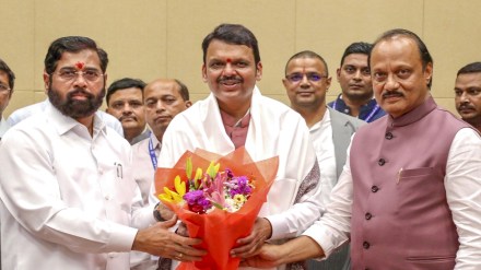 Maharashtra Chief Minister Devendra Fadnavis being felicitated by Deputy CMs Eknath Shinde and Ajit Pawar at the Cabinet meeting, in Mumbai. (PTI Photo)