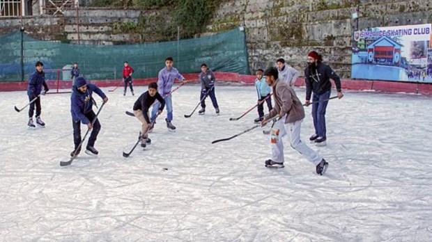 Ice hockey enthusiasts showcase their skills at Lakkar Bazar in Shimla on Saturday, December 21, 2024. The lively game amid the winter chill adds a vibrant touch to the season, attracting spectators to the iconic skating rink. (Photo: PTI)