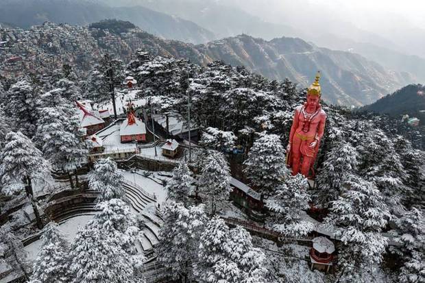 The Jakhu Temple and its premises are covered with snow after a fresh snowfall, in Shimla. (Photo source: PTI)