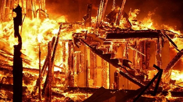 Flames consume a building as the Eaton Fire rages in Pasadena, California, on January 7, 2025. (Image Source: Reuters)