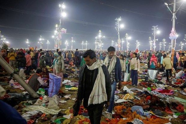 Devotees walk away after a deadly stampede occurred before the second 