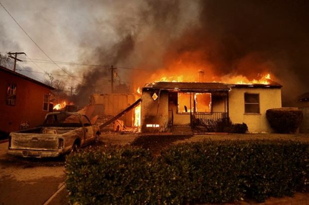 A house is consumed by flames as strong winds intensify the destructive wildfires in the Los Angeles area, forcing evacuations at the Eaton Fire in Altadena, California, on January 8, 2025. (Image Source: Reuters)
