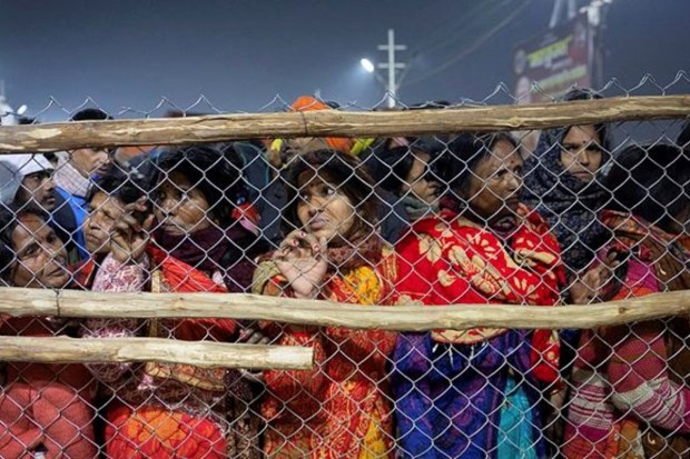 Devotees react after being stopped by policemen following a deadly stampede before the second 