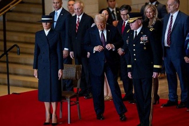 President Donald Trump and First Lady Melania Trump arrive for a review of the troops in Emancipation Hall during inauguration ceremonies at the U.S. Capitol in Washington, on Jan. 20, 2025. Angelina Katsanis/Pool via REUTERS